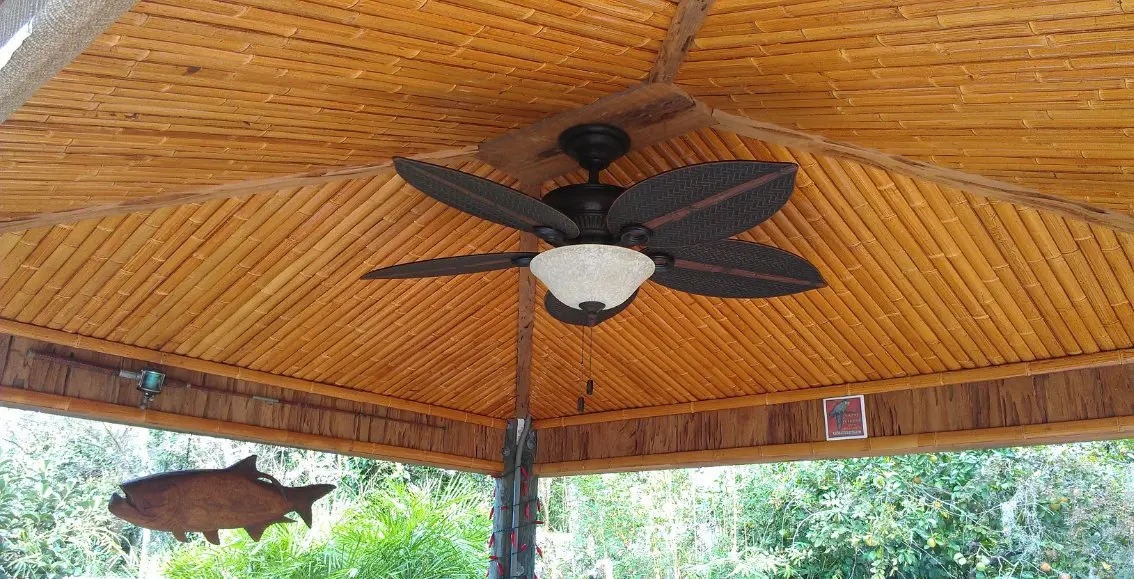 bamboo slats on a ceiling with a fan